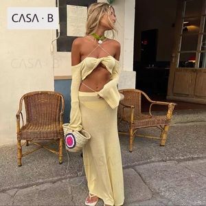 PORTOFINO Pastel Yellow Twist Front Off-Shoulder Halter Crop & Midi Skirt Set